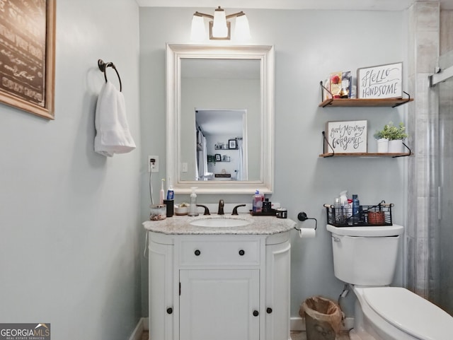 full bathroom with toilet and vanity