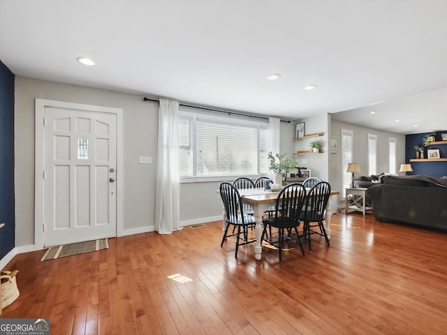 dining area featuring recessed lighting, light wood-type flooring, and baseboards