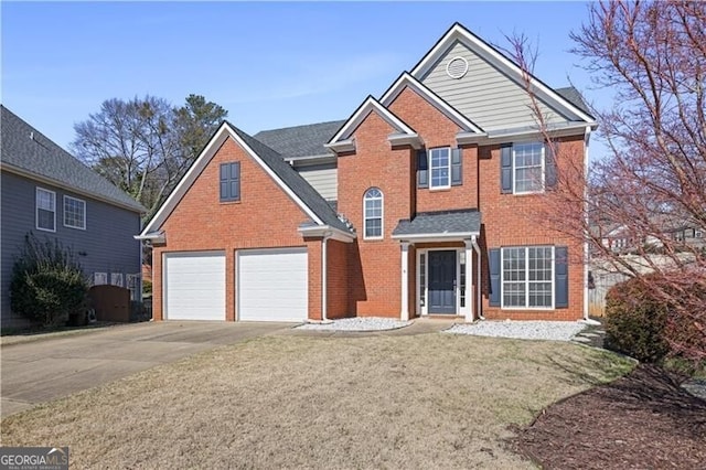 view of front of home featuring driveway, an attached garage, a front lawn, and brick siding