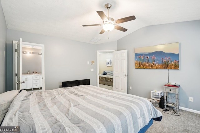 carpeted bedroom featuring lofted ceiling, baseboards, and a ceiling fan