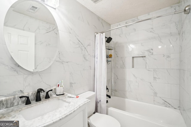 full bath featuring shower / tub combo, visible vents, toilet, a textured ceiling, and vanity