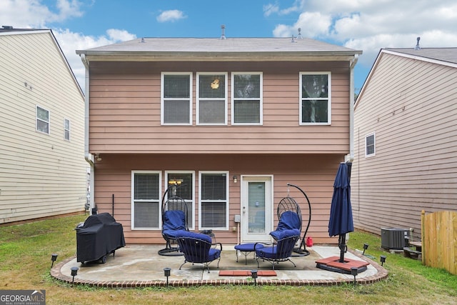 back of property featuring a patio, a lawn, and cooling unit