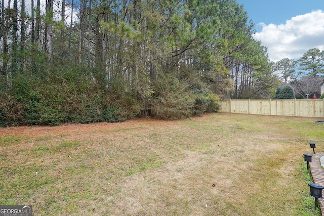 view of yard featuring fence