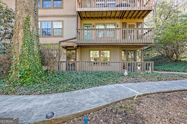 view of front of house featuring a balcony