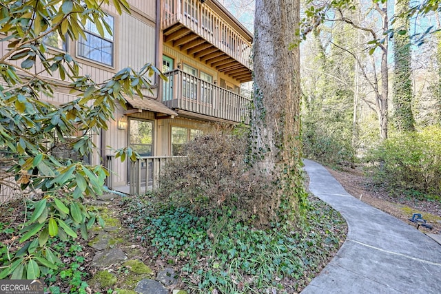 view of home's exterior with a balcony