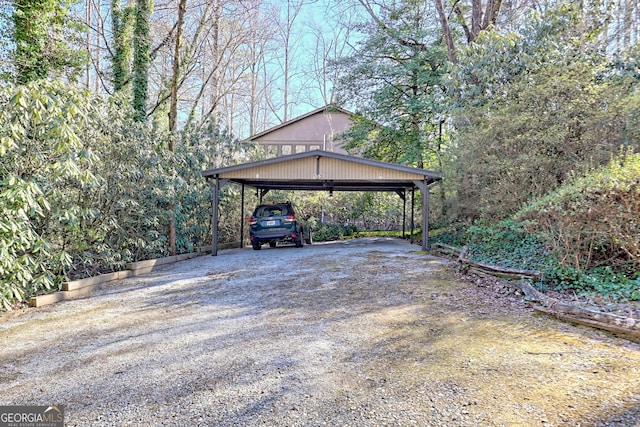 view of vehicle parking featuring a carport and driveway