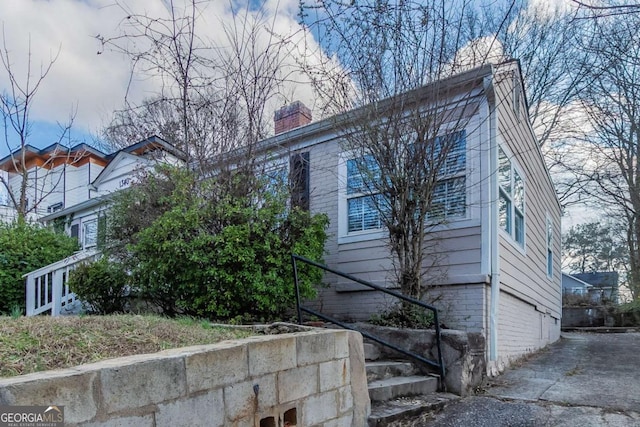 view of side of property with a chimney