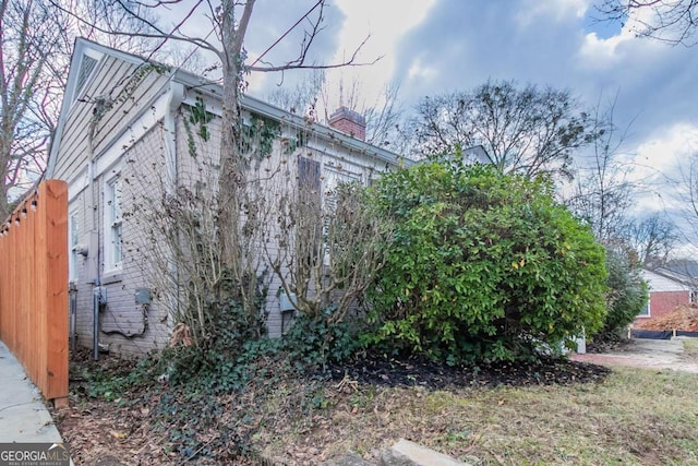 view of home's exterior featuring a chimney