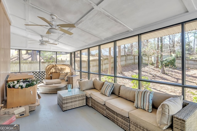 sunroom featuring a ceiling fan