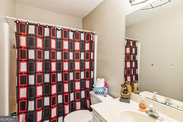 full bathroom featuring a textured ceiling, curtained shower, vanity, and toilet