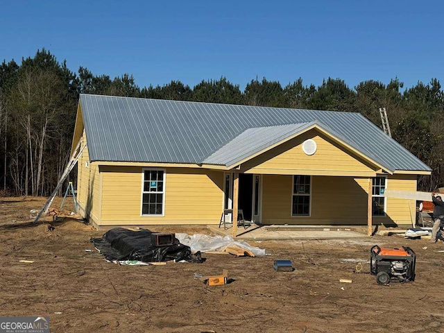 view of front of property featuring metal roof