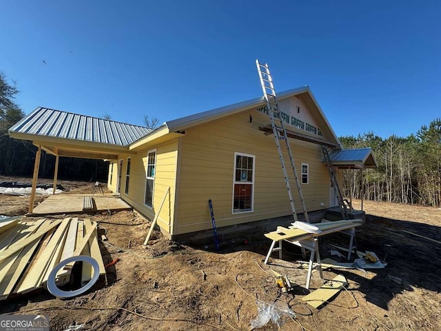 view of home's exterior with metal roof