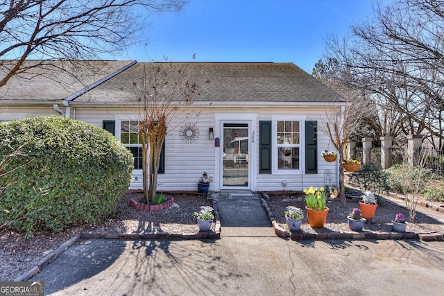 bungalow-style house featuring a shingled roof