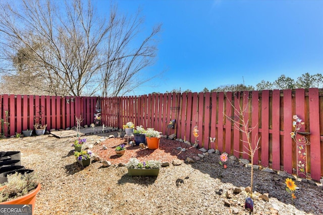 view of yard with a fenced backyard