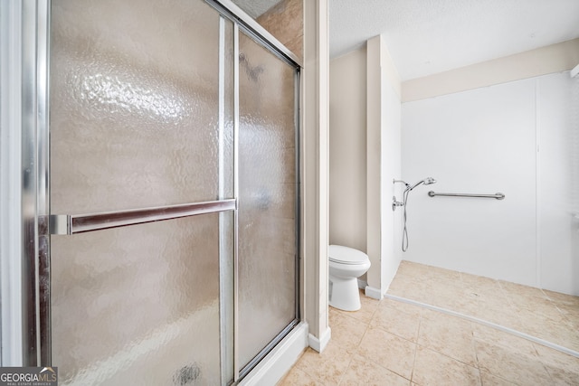 bathroom with toilet, a stall shower, and tile patterned floors