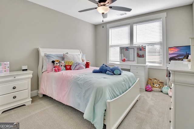 bedroom with light carpet, visible vents, and a ceiling fan