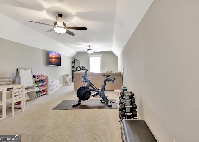 exercise area featuring lofted ceiling, light carpet, and baseboards