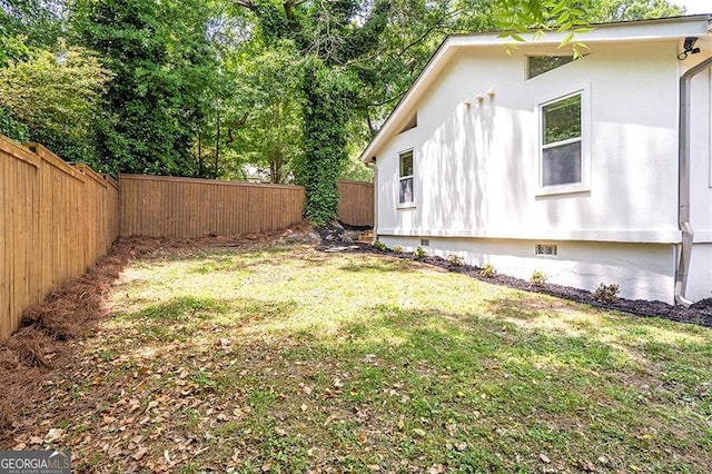 view of yard with a fenced backyard