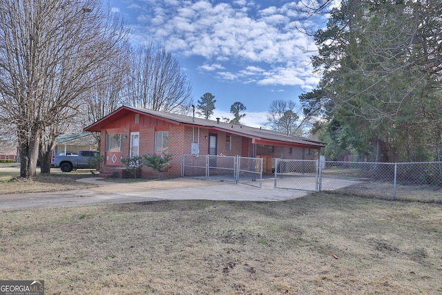 single story home with a gate, brick siding, fence, and a front lawn