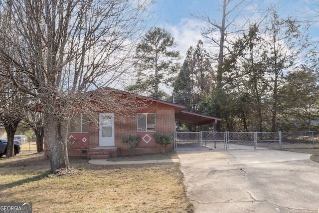 view of front of house with entry steps, brick siding, fence, concrete driveway, and crawl space