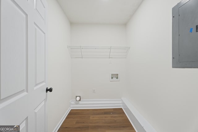 laundry room featuring hookup for a washing machine, laundry area, baseboards, electric panel, and dark wood finished floors