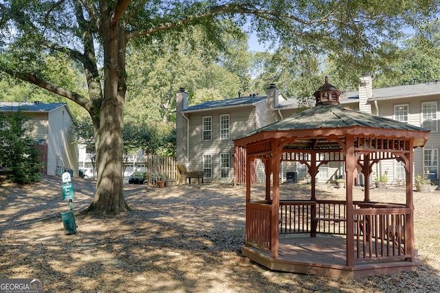 view of home's community featuring a gazebo and a wooden deck