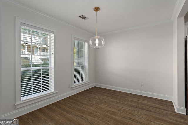 unfurnished room featuring baseboards, visible vents, dark wood-style flooring, and ornamental molding