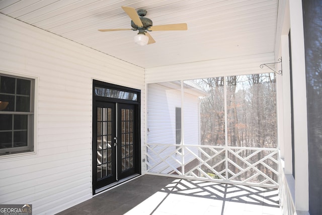 doorway to property featuring french doors and a ceiling fan