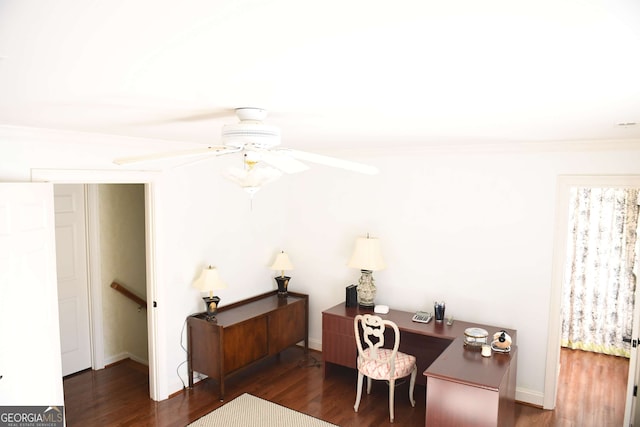 home office featuring ceiling fan, crown molding, and dark wood-style flooring