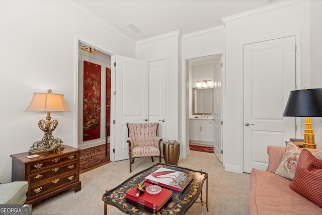 sitting room with light carpet and ornamental molding