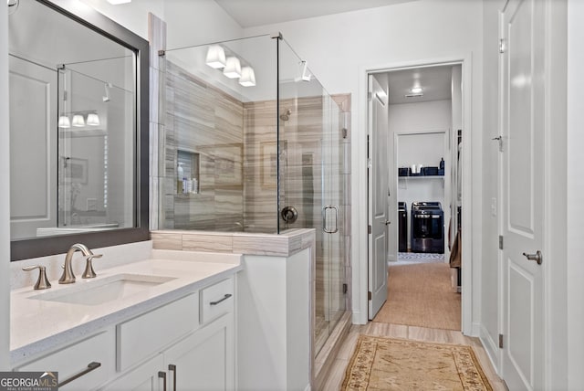 full bathroom with a stall shower and vanity