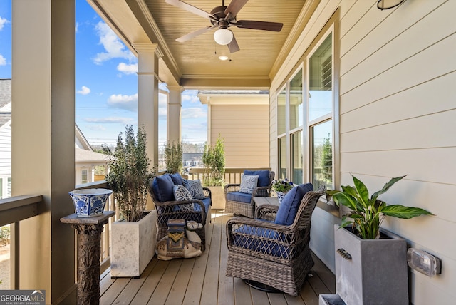 deck featuring ceiling fan and an outdoor hangout area