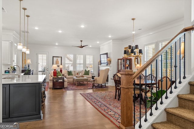 interior space featuring light countertops, a sink, and crown molding