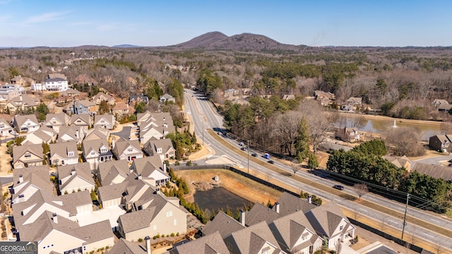 birds eye view of property with a mountain view and a residential view