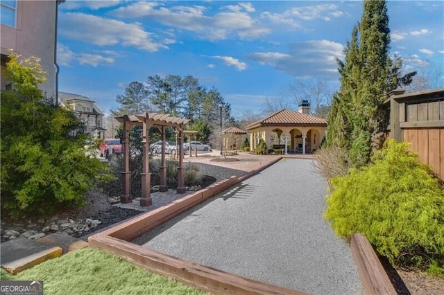 view of property's community featuring a gazebo and a pergola