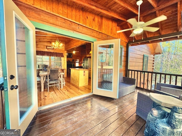 sunroom / solarium with wooden ceiling, vaulted ceiling with beams, and ceiling fan with notable chandelier