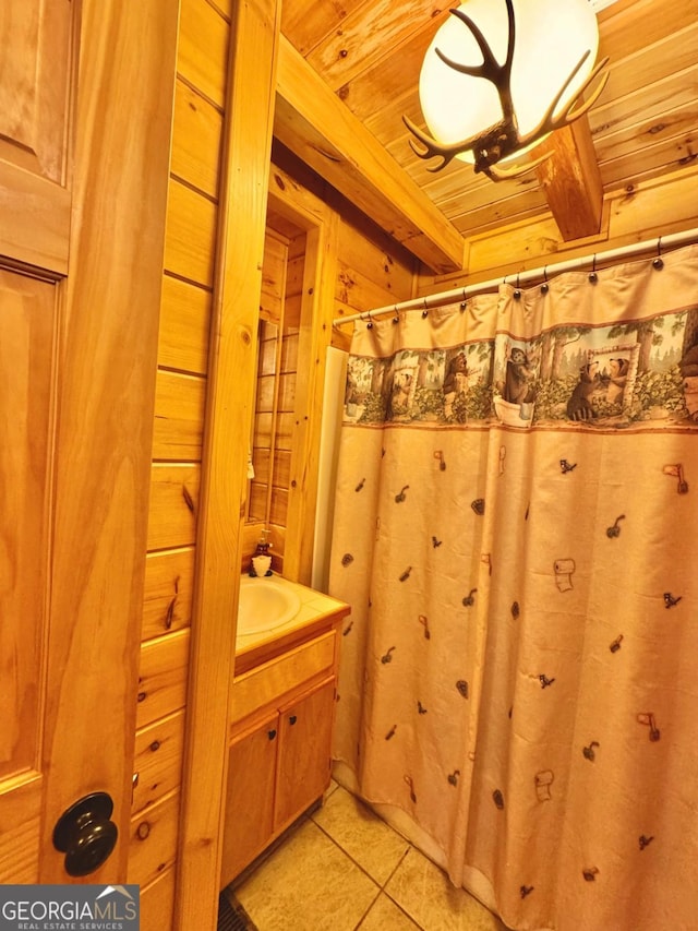 full bath featuring wooden ceiling, vanity, and tile patterned floors