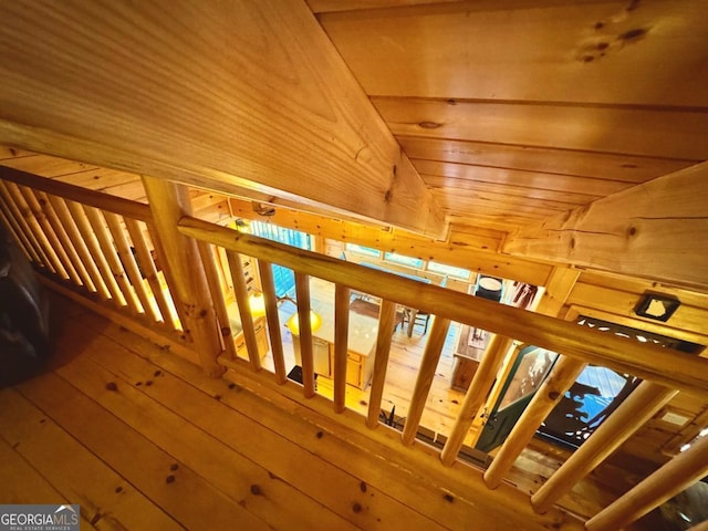 interior space featuring wood walls and wood finished floors