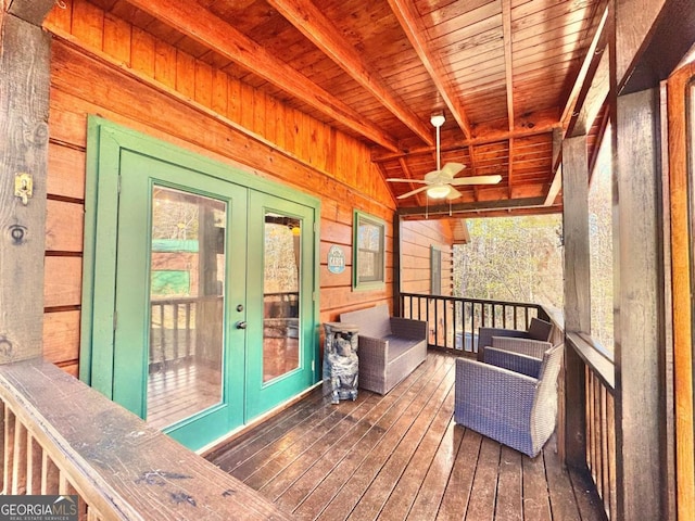 deck featuring french doors and a ceiling fan