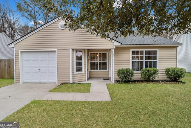 view of front of home featuring roof with shingles, concrete driveway, an attached garage, fence, and a front lawn