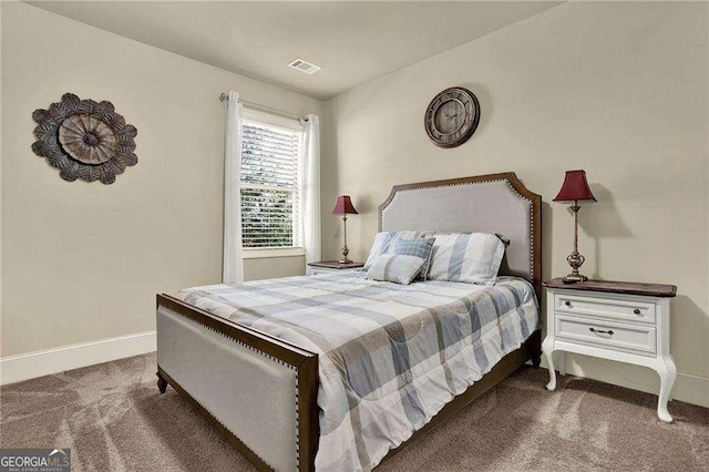 bedroom featuring carpet, visible vents, and baseboards