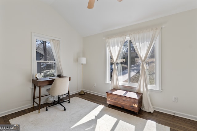 office space with lofted ceiling, a healthy amount of sunlight, dark wood finished floors, and baseboards