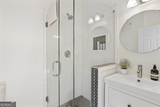 full bath featuring a stall shower and a sink