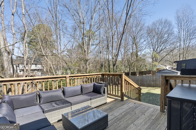 wooden deck featuring fence and an outdoor living space