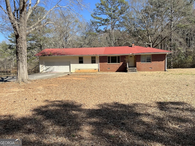 single story home with entry steps, an attached garage, brick siding, driveway, and crawl space