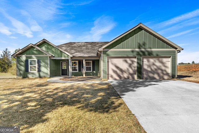 view of front of home with driveway, board and batten siding, and an attached garage