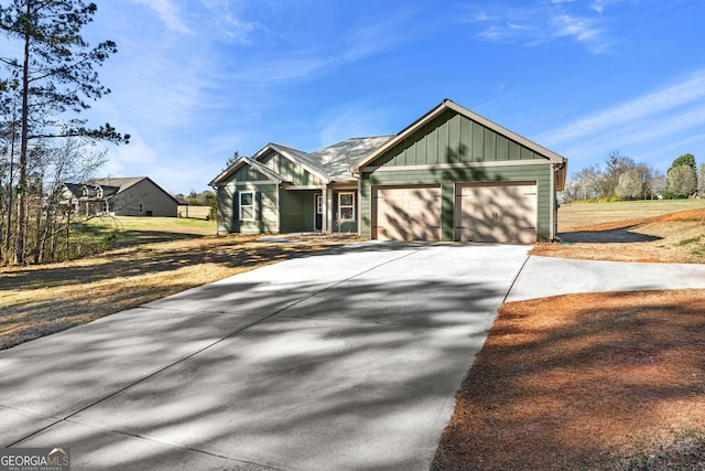 view of front of home featuring driveway, an attached garage, and board and batten siding