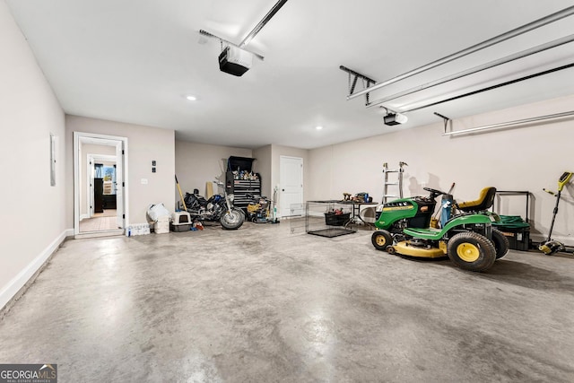 garage with baseboards and a garage door opener