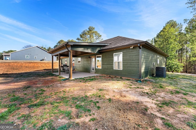 rear view of house featuring a patio area and central air condition unit