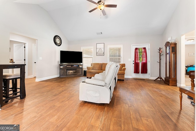 living area with a healthy amount of sunlight, light wood-style floors, and visible vents